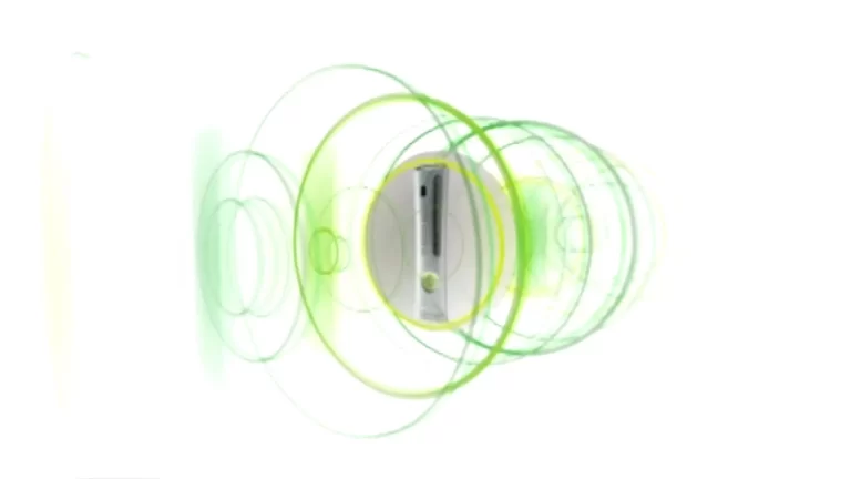 Image of a gaming console surrounded by overlapping green circular waves on a white background.