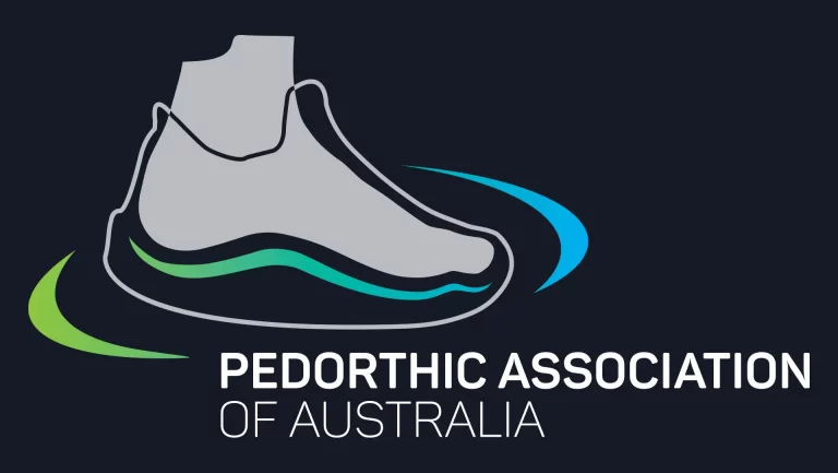 Logo of the Pedorthic Association of Australia featuring an outlined shoe with curved green and blue lines around it, and the text "Pedorthic Association of Australia" below the image.